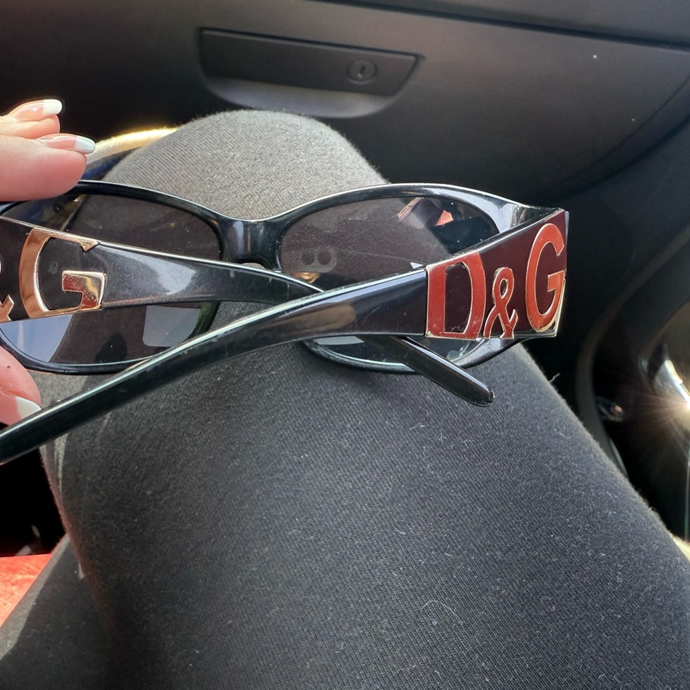 Dolce and Gabana Black Sunglasses with Striking gold Logo.